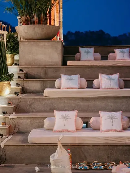 The amphitheater steps are set with comfortable cushions for guests to watch the ceremony.