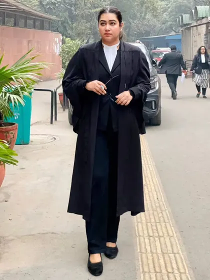 In my advocate's gown, ready for court. Lawyers are most alive in the courtroom, where we stand to defend our clients' rights.