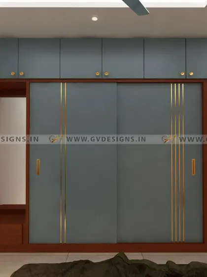 Another view of the grayish-blue wardrobe, this time with an integrated dressing mirror and seating area. This design shows how we can combine storage, display, and functional areas into one seamless and stylish unit.
