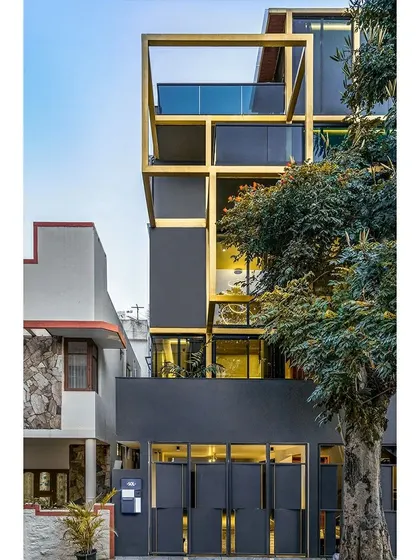 A duplicate of ID 122, this image of the SOL House shows its striking yellow steel frame against the urban backdrop. The design is a playful yet rigorous exploration of how a structural grid can become the primary architectural expression of a home.