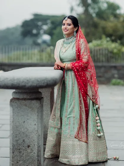 This bride chose a stunning mint green lehenga for her engagement. I created a soft glam look with defined eyes and a neutral lip to complement her modern outfit.