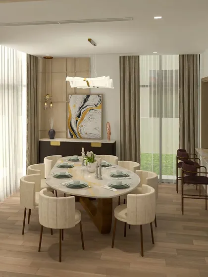 The dining area in the Dubai project features an elegant oval marble-top table and upholstered chairs, perfect for sophisticated entertaining.