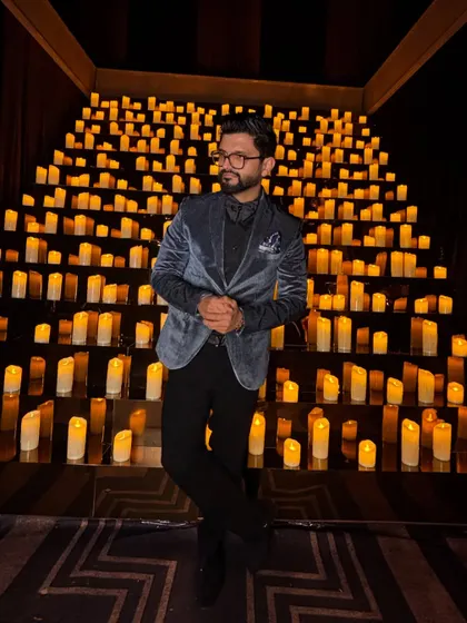 A velvet blazer against a backdrop of a thousand candles. This look is all about creating a dramatic and memorable entrance.