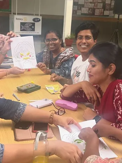 Teachers at DPS Nashik showing off their creative drawings during an activity about fractions. This hands-on, artistic approach makes learning abstract concepts like fractions more intuitive and fun.