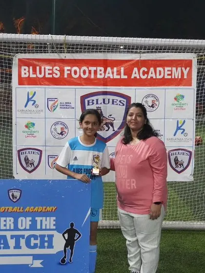 Another shot of the "Player of the Match" award ceremony, showing the pride and recognition that comes with exceptional performance.