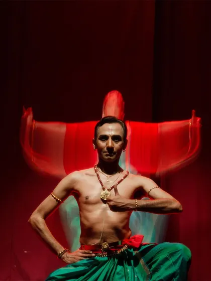 An artistic shot from "Tyāgarāja Hṛt Sādana" with a slow shutter speed, creating a ghostly trail of movement. This captures the ethereal and spiritual quality of the dance.
