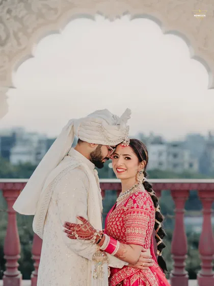 An intimate embrace overlooking the city from a beautiful arched balcony. This candid moment captures the couple's connection, framed by the elegance of the architecture. It showcases how I blend grand locations with personal, emotional photography.