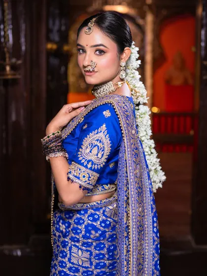 A view of the traditional Maharashtrian bridal hairstyle, adorned with a beautiful gajra, completing the royal look.