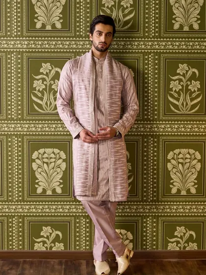 The full-length view of the mauve kurta set showcases its elegant drape and timeless silhouette. It's a perfect example of quiet luxury.
