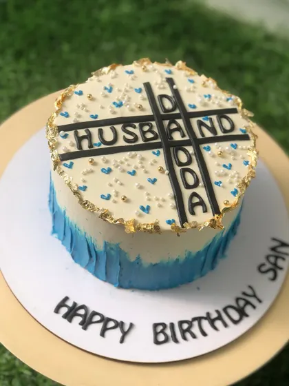 A special cake for a husband and dad, designed like a crossword puzzle with his most important titles.