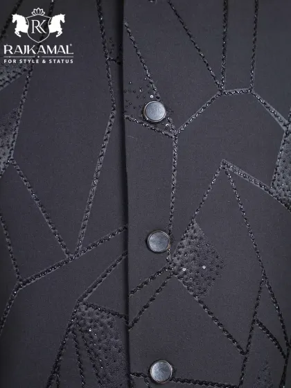Another detail shot of the buttons and geometric beadwork on the black Jodhpuri.