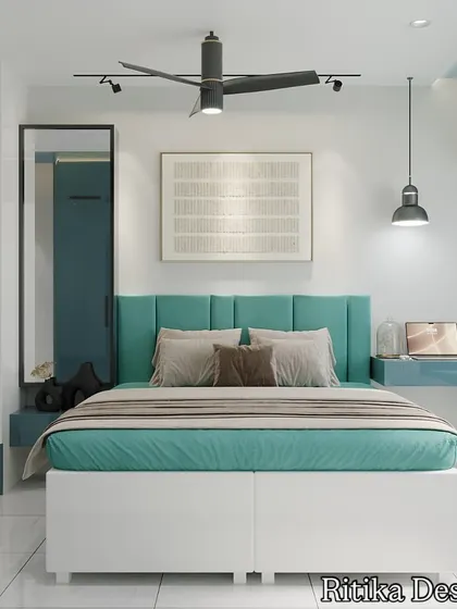 This bedroom features a soothing teal and white color scheme. We designed a custom bed with a channel-tufted headboard and integrated a floating desk and a window seat, making the room multifunctional for both rest and work.