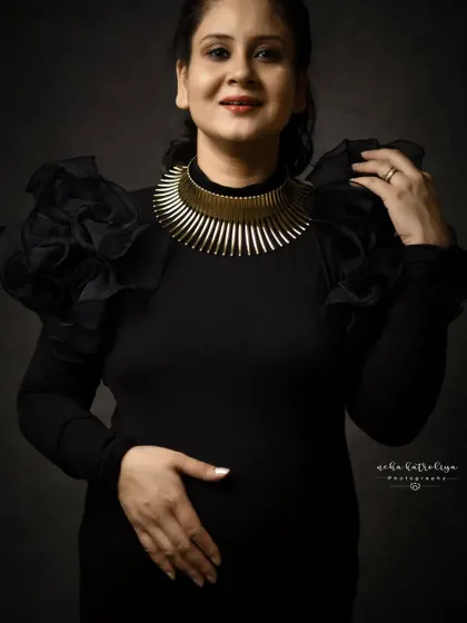 A closer look at the details. The ruffled sleeves and statement necklace were key parts of this powerful, self-styled look.