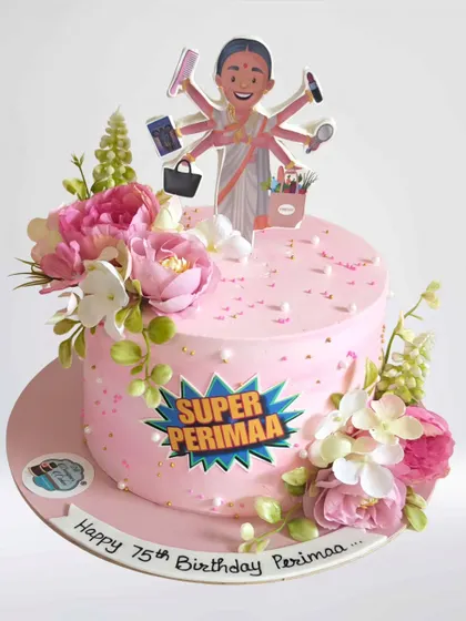 A "Super Perimaa" cake for a 75th birthday. This cake celebrates a beloved family matriarch with a custom topper and beautiful fresh flowers.