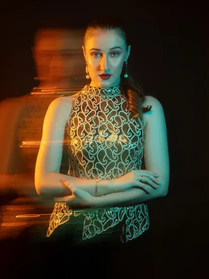 A powerful and confident pose. The ghosting effect of the long exposure adds a layer of mystery and intrigue.