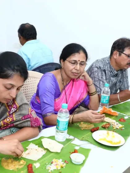 Guests enjoying a quiet moment with their food during a busy event.