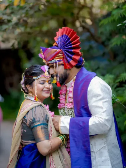 An intimate portrait capturing the groom whispering to his bride, a secret moment shared between just the two of them.