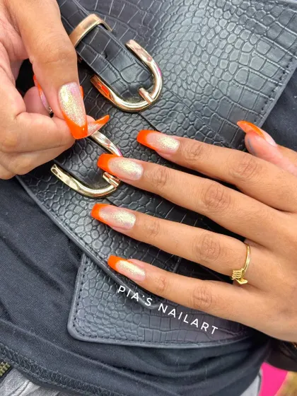Fresh orange tips with a touch of sparkle. A bright and fun look.