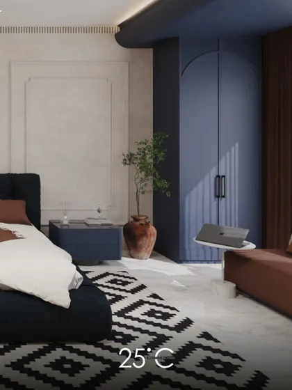 A bedroom design that uses a bold and contemporary color scheme of navy blue and terracotta. The arched wardrobe doors and geometric rug add personality and modern flair to the space.