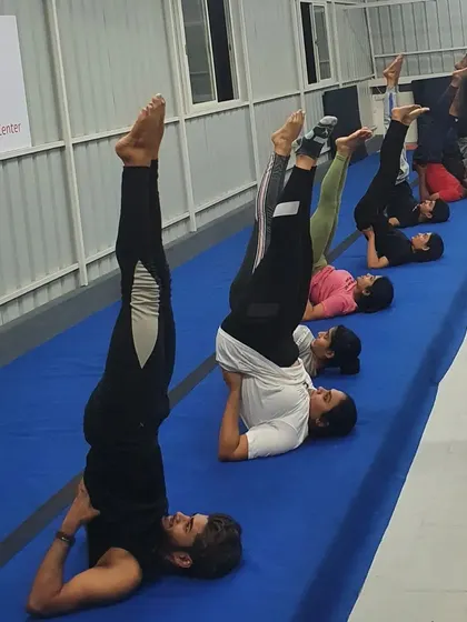 Shoulder stands are a great way to build core stability and balance. Our adult class practices these together as part of their conditioning work.