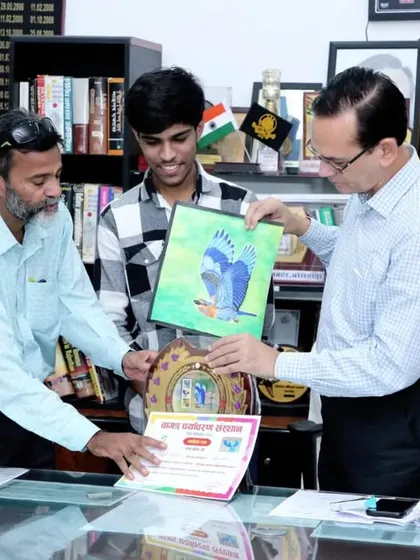 Receiving the award and certificate from the District Collector. These moments are a great encouragement for any artist.