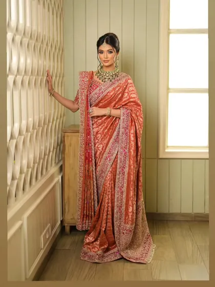 The elegance of this drape is evident in how it falls, creating a silhouette that is both traditional and incredibly chic.
