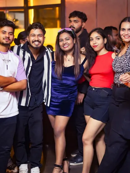 A group of friends gathered together, enjoying the party and making memories.