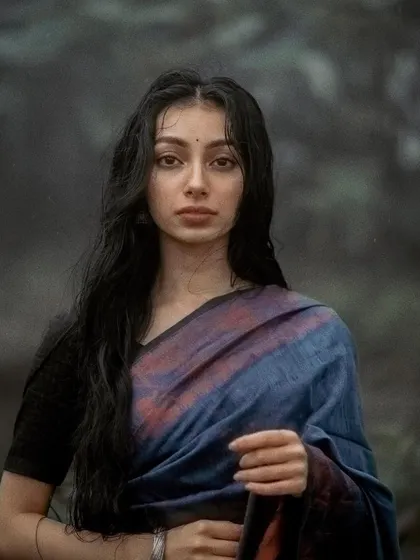 A direct, straight-on portrait from the monsoon series. Even in the stillness, I try to convey an inner emotional landscape.