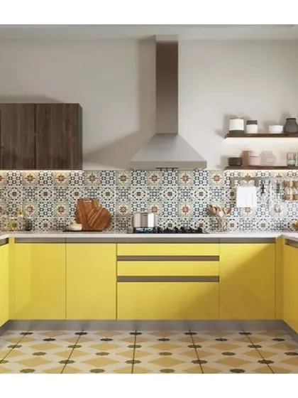 A cheerful yellow modular kitchen with a patterned tile floor and a colorful backsplash, creating a vibrant and energetic cooking space.