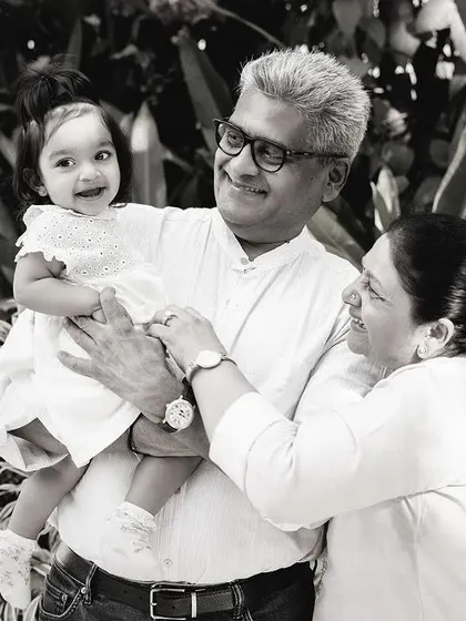 The same beautiful moment with grandparents, captured in timeless black and white to emphasize the emotion and connection across generations.
