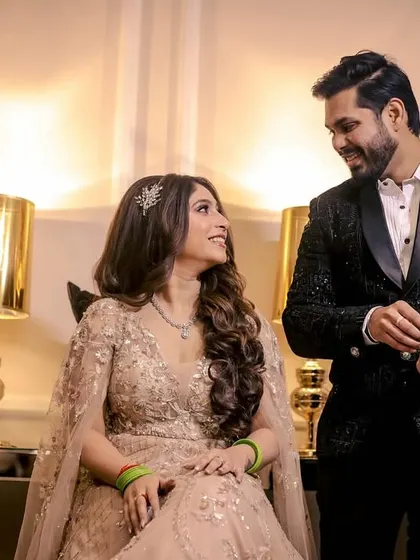 A candid moment of the couple sharing a look during their engagement shoot.