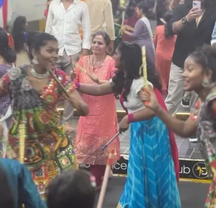 Smiles and dandiya sticks in action. Our instructors are right there on the floor, dancing with everyone and keeping the energy up.