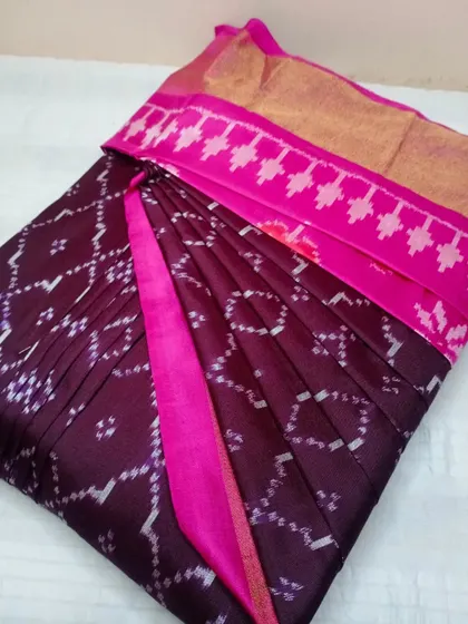 This wine-colored ikat-style saree is pleated and ready to go. My service handles all types of sarees, from traditional silks to modern designs.