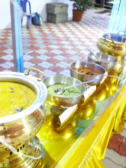 A line of our signature dishes in brass serving pots, ready for service.