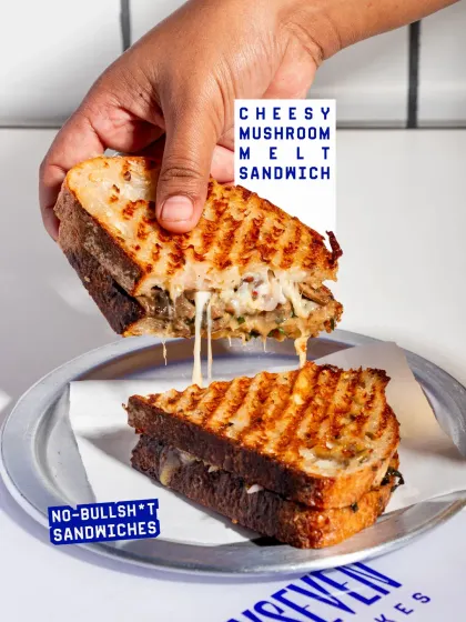 The ultimate cheese pull from my Cheesy Mushroom Melt Sandwich. It's loaded with a savoury mushroom-cheese mix and mint pesto on my signature seeded sourdough.
