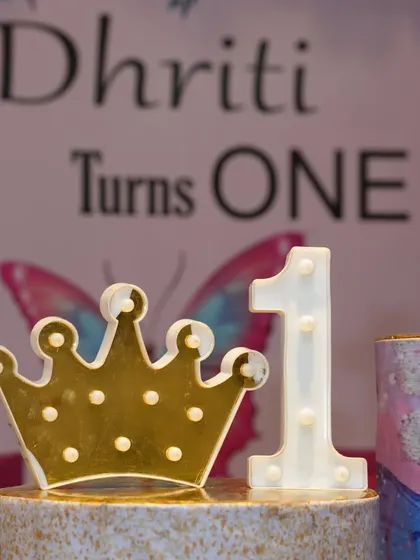 A detail shot of the light-up crown and number "1" for a first birthday party. These props look great in photos.