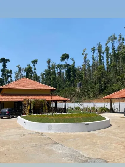 This is a duplicate of ID 110. A view of the Sakleshpur estate bungalow, showing the new driveway and landscaping.
