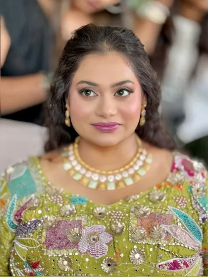 Another portrait from the carnival event, showing the client's glowing skin and vibrant makeup.