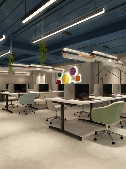 This render shows a workstation layout with geometric wall patterns and colorful seating. The design is modern, playful, and designed to boost morale and productivity.