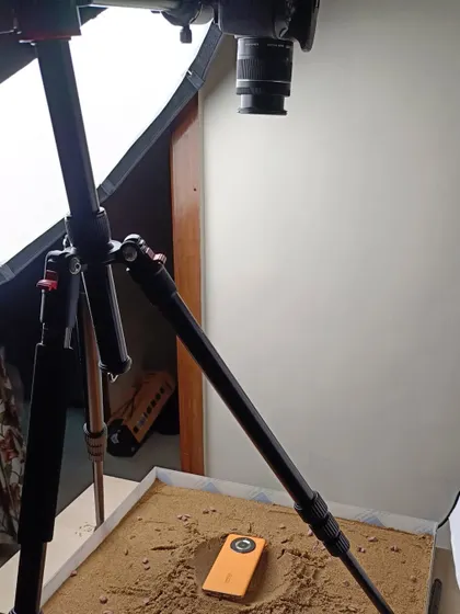 The behind the scenes setup for the "Mars terrain" realme Narzo shoot. You can see the sand pit, the overhead camera rig, and the lighting I used to create the otherworldly scene.