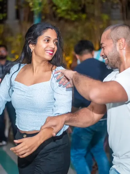 A stylish pair moving with grace and connection. The chemistry is evident in their dance.