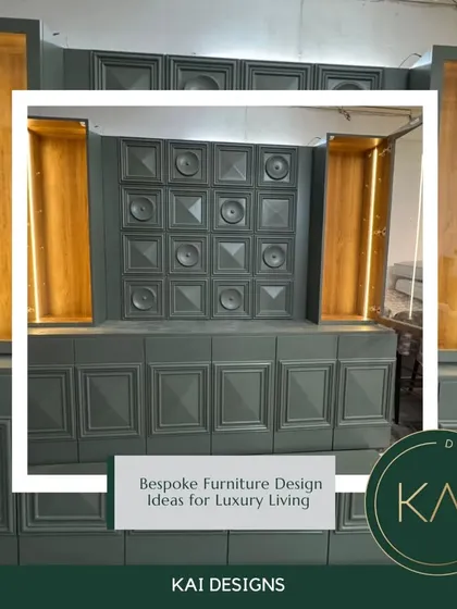A grand, custom-built wall unit in a deep grey finish with gold-leafed, illuminated display niches. This piece was designed as a dramatic focal point for a luxury residence.