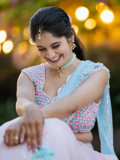 A happy, candid moment. The soft lighting highlights her glowing skin and the joyful expression that comes from feeling truly beautiful.