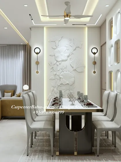 This dining area features a statement wall with a 3D floral bas-relief sculpture, beautifully illuminated to create a dramatic effect. It turns the simple act of dining into a luxurious experience.