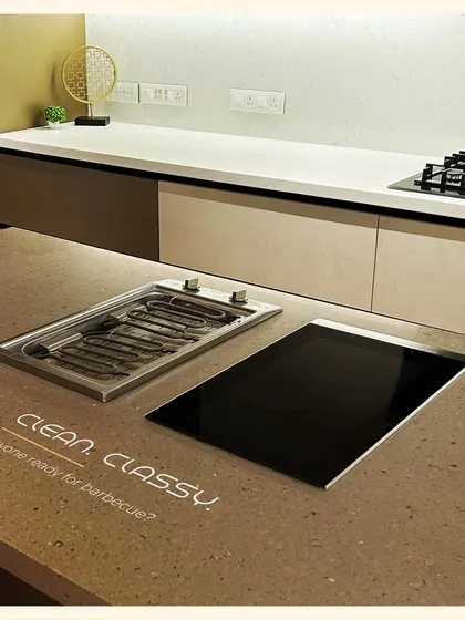 Why not have a barbecue indoors? We can integrate specialized appliances like this indoor grill right into your countertop for a clean and classy cooking experience.