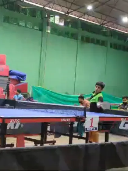 A young player in action during a tournament, demonstrating the focus and technique honed during countless hours of practice at our academy.