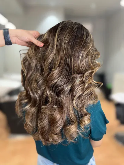 A gorgeous butterscotch blonde balayage. This warm, sweet shade is perfect for adding a rich and sunny glow to your hair.