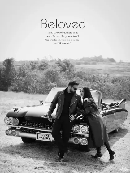 A stylish black and white photograph featuring a couple posing with a vintage convertible. This image captures a cool, retro vibe, perfect for a timeless and edgy pre-wedding album.