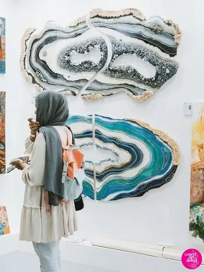 Chatting with a visitor at the World Art Dubai exhibition. It's such a joy to share the stories and inspiration behind my geode artworks with people from around the world.