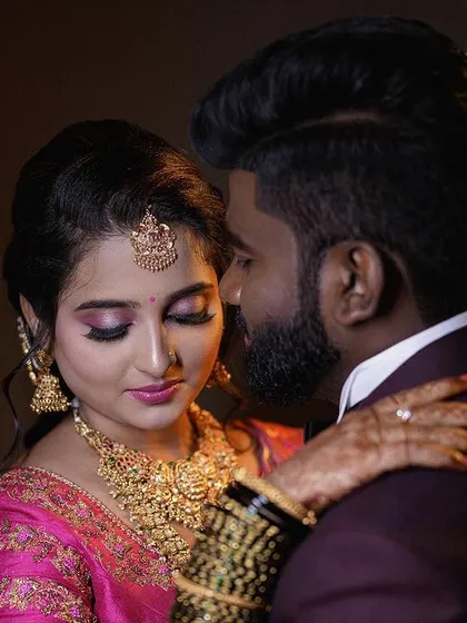 A close-up, romantic portrait of a couple at their reception. I use controlled studio-style lighting even during live events to create these polished, magazine-worthy shots that highlight emotion and detail.